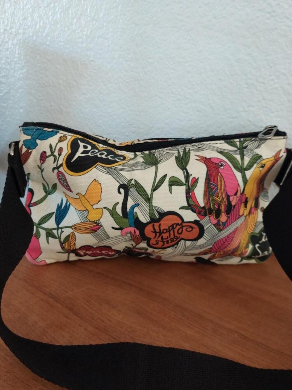 Sakroots Peace and Love crossbody bag fanny with colorful birds and floral desig